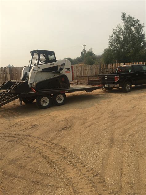 rams trucks pulling a trailer with skid steer|Can a 1/2 ton pick.